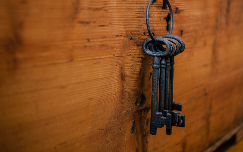 Skeleton keys hang on a key-ring as representation of the commitment inherent in offering a five year warranty on this Muskoka custom builder's construction projects.
