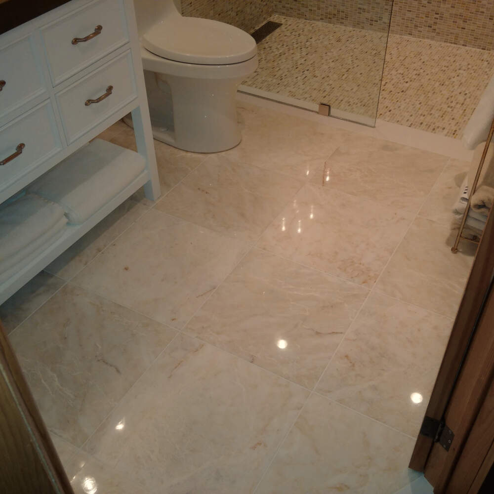 Polished marble tile floor in the luxury bathroom of a cottage near Gravenhurst in Muskoka, Ontario.