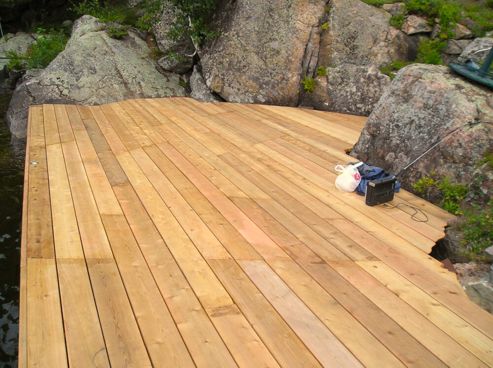 Freshly installed cedar decking on Lake Rosseau dock construction project.
