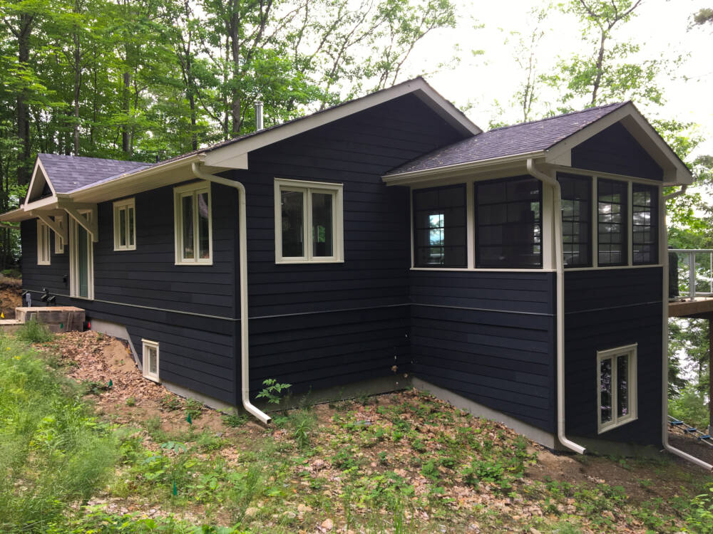 The exterior view of a completed home construction project on Lake Muskoka.