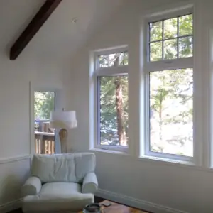 The clean, white painted nterior of the cottage's Muskoka Room gives the space a bright feel with lots of daylight.