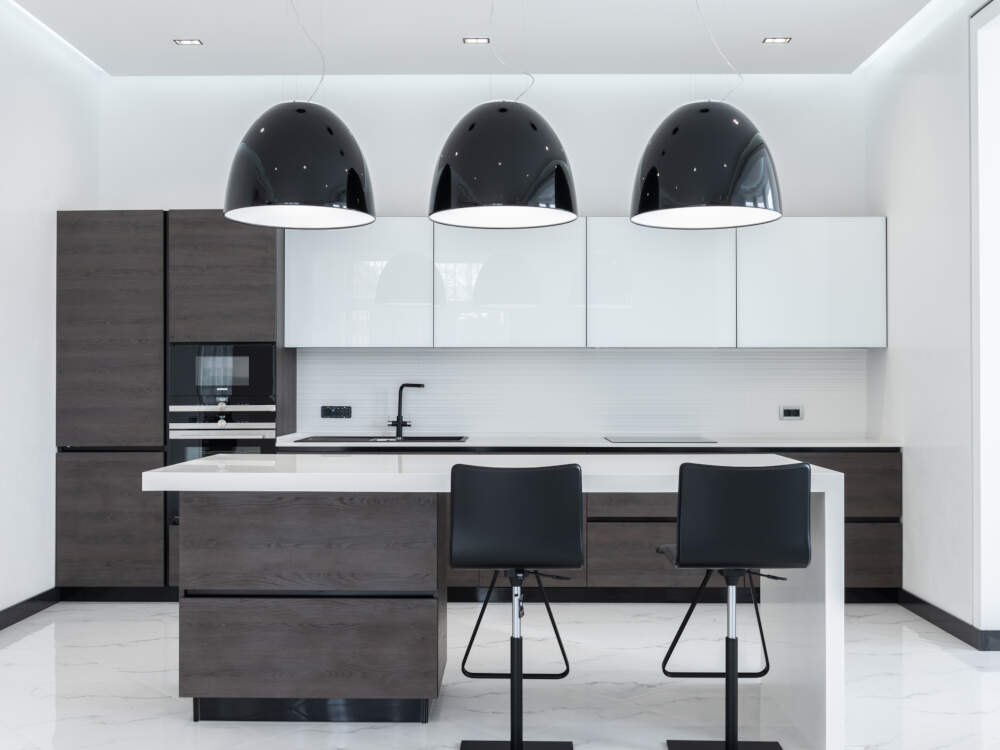 Bright daylight due to large glass areas is characteristic in the interior of modern home designs.