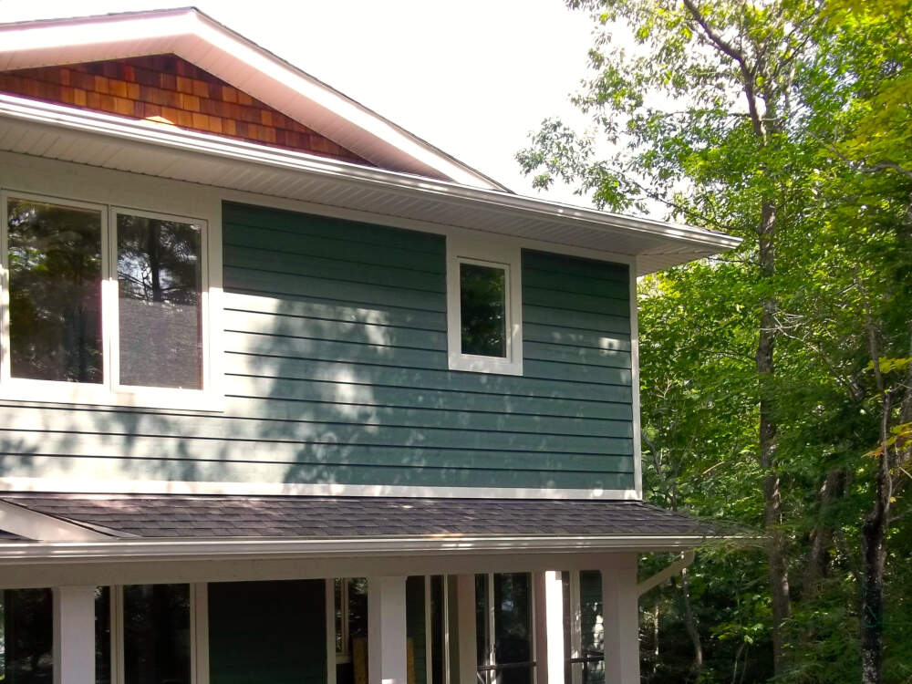 Gable end walls decorated in western red cedar shingles are a staple component of traditional Muskoka cottage architecture.