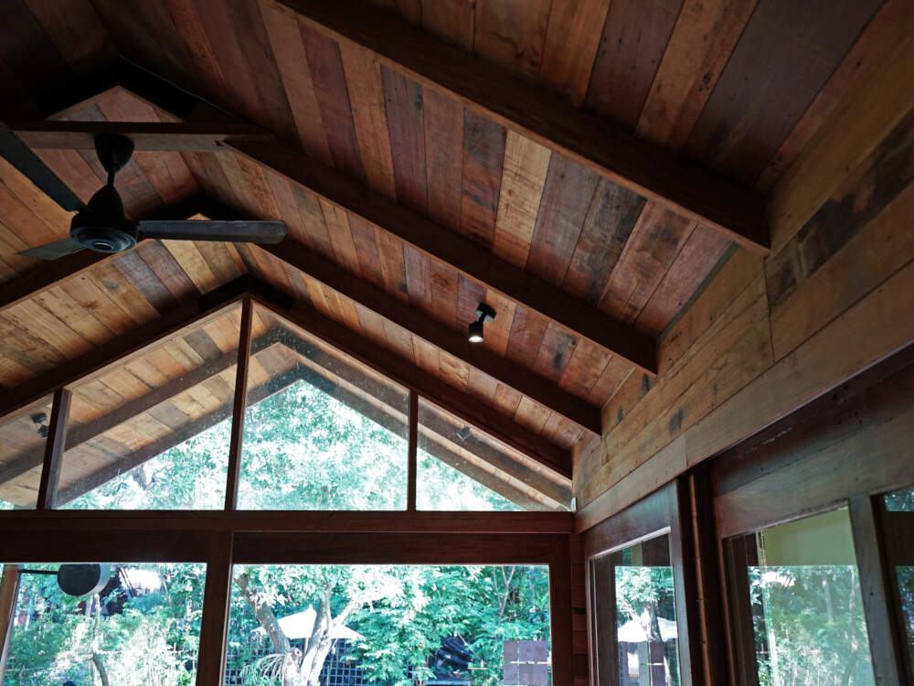 Vaulted cathedral ceilings supported by solid timber frame rafters and finished with wood decking are common in timberframe homes.